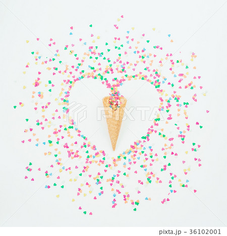 Heart symbol of colorful candy confetti and waffle Heart symbol of colorful candy confetti and waffle 36102001