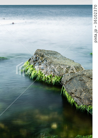 Long exposure of sea and rocks 36102370