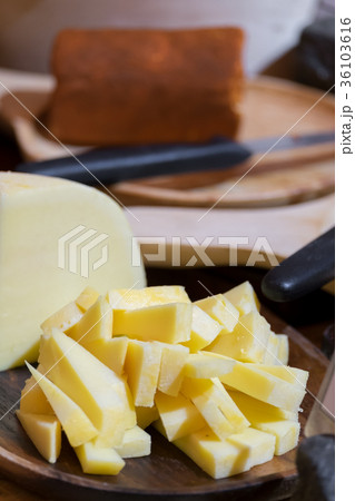 Slice gouda cheese on plate wooden table. Slice gouda cheese on plate wooden table. 36103616