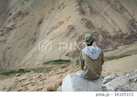 Asian traveler enjoying mountain view Asian traveler enjoying mountain view 36105372
