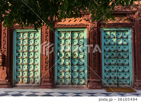 Wooden doors at ancient temple in Jodhpur, India 36105494