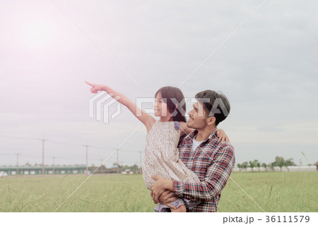 Father and daughter in happiness in the meadow Father and daughter in happiness in the meadow 36111579