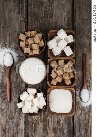 Six bowls of sugar and two wooden spoons Six bowls of sugar and two wooden spoons 36117465