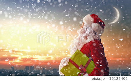 Santa Claus looking at city 36125402