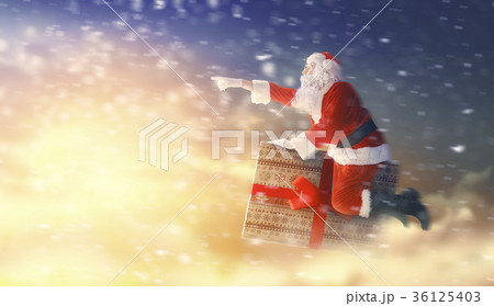 Santa Claus flying on gift box 36125403