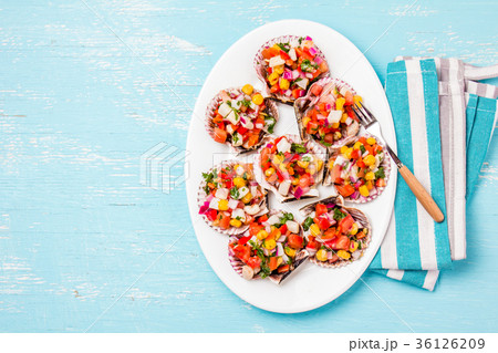 Peruvian style food Scallops a la chalaca 36126209