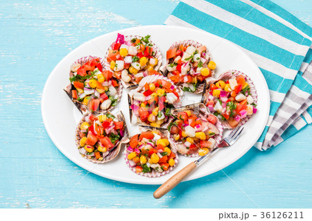 Peruvian style food Scallops a la chalaca 36126211