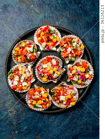 Peruvian style food Scallops a la chalaca 36126215