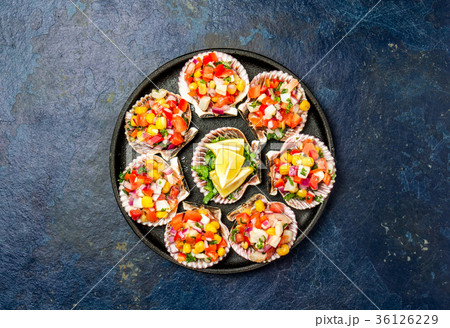 Peruvian style food Scallops a la chalaca 36126229