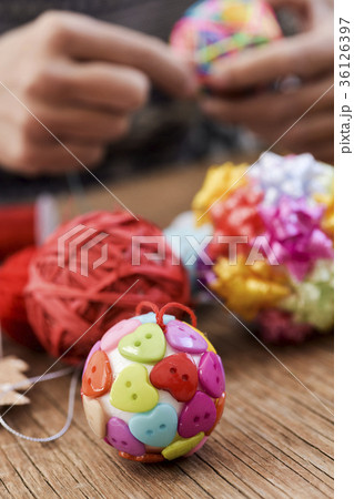 man making handmade christmas balls man making handmade christmas balls 36126397