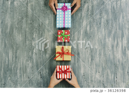 woman and man exchanging gifts woman and man exchanging gifts 36126398