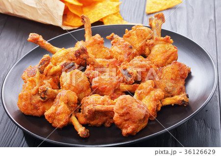 chicken winglets, nachos in paper bag 36126629