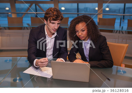 Business people having meeting around table in 36128016