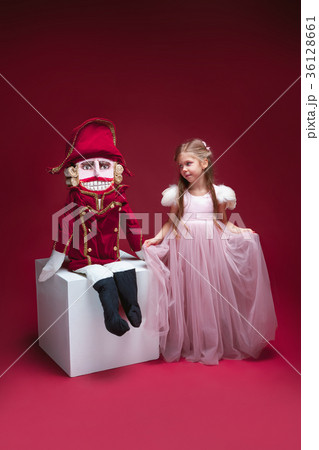The beauty ballerina standing with nutcracker The beauty ballerina standing with nutcracker 36128661