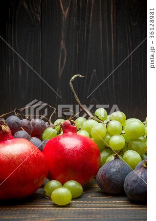 Lots of different fruits on wooden background 36128981