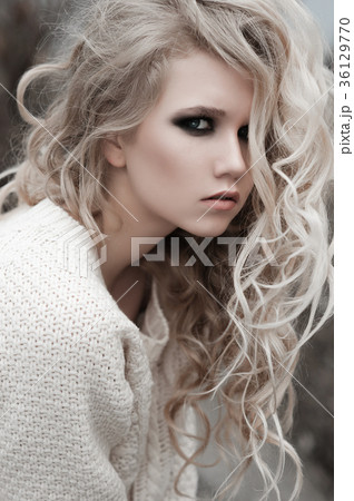 beautiful young blonde woman with blue eyes beautiful young blonde woman with blue eyes 36129770