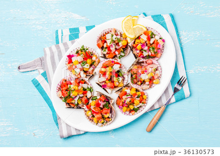 Peruvian style food Scallops a la chalaca 36130573