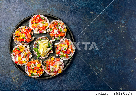 Peruvian style food Scallops a la chalaca 36130575