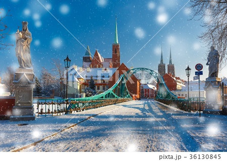 Tumski Bridge in snowy winter day, Wroclaw, Poland Tumski Bridge in snowy winter day, Wroclaw, Poland 36130845