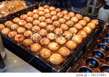 Cooking Takoyaki grilling on steel pan Cooking Takoyaki grilling on steel pan 36137681