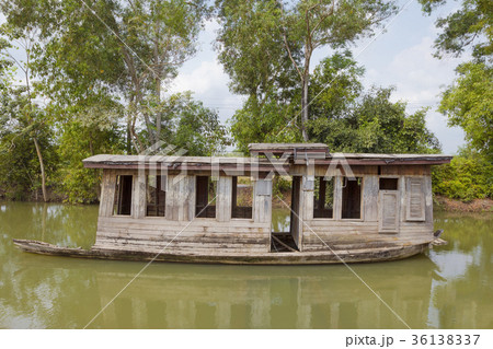 Old abandoned wooden boat in canal 36138337