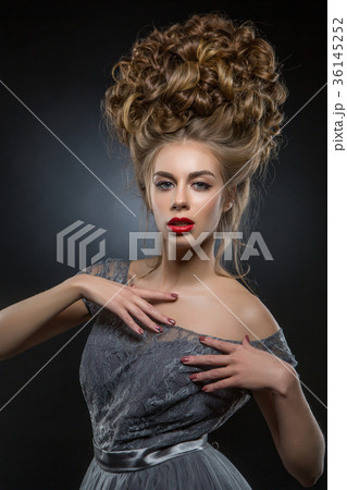 beautiful girl with big curly hairstyle 36145252