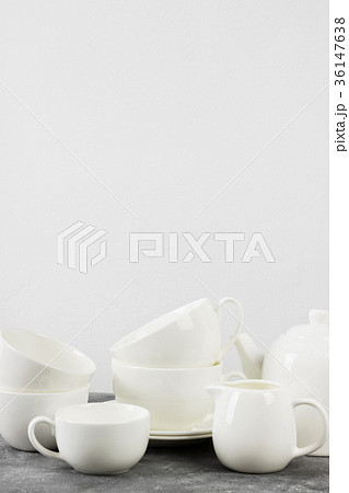 Clean white tableware (teapot, cups, saucers) Clean white tableware (teapot, cups, saucers) 36147638