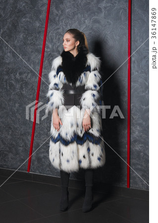 Attractive girl in long bouffant fur coat Attractive girl in long bouffant fur coat 36147869