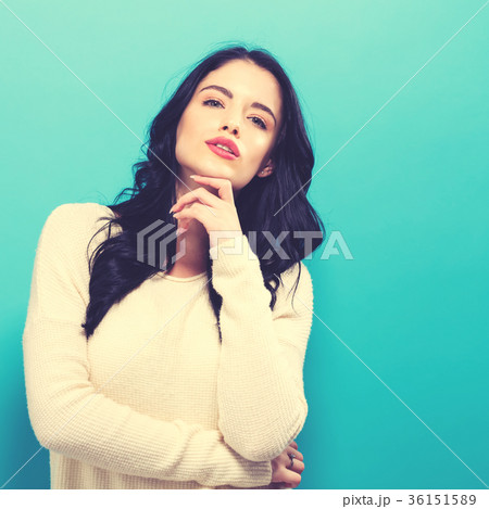 Happy young woman on a solid background Happy young woman on a solid background 36151589