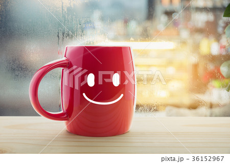 Red mug of coffee with a happy smile. Red mug of coffee with a happy smile. 36152967