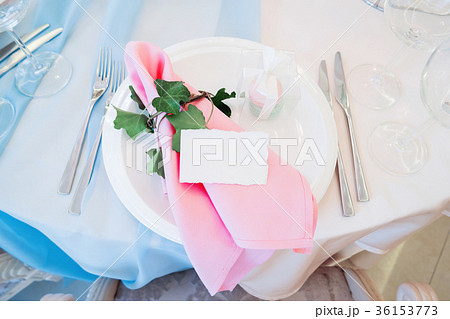 Table set for wedding banquet with cutlery.  36153773