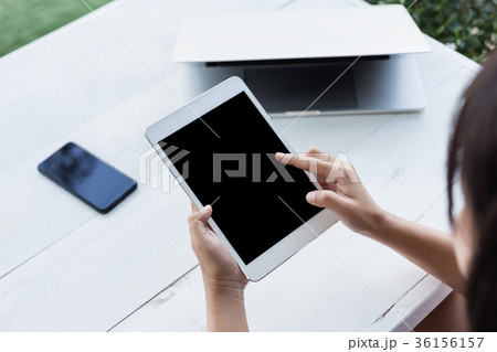 hand holding digital tablet finger point on screen hand holding digital tablet finger point on screen 36156157
