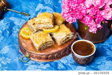 Baklava with Turkish coffee in copper cups Baklava with Turkish coffee in copper cups 36156956