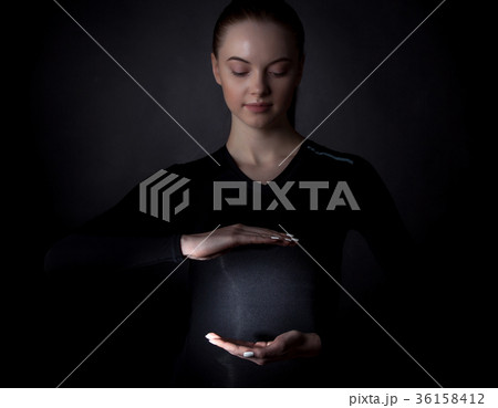 Woman holding abstract glowing object Woman holding abstract glowing object 36158412
