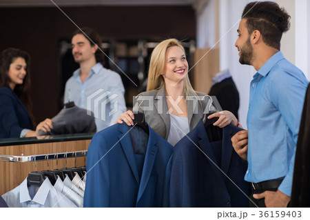 Handsome Man Try New Jackets With Attractive Handsome Man Try New Jackets With Attractive 36159403