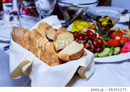 Pieces of bread on a basket in a restaurant Pieces of bread on a basket in a restaurant 36161273