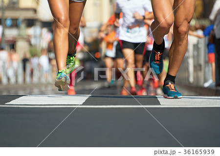 Marathon running in the light of evening 36165939