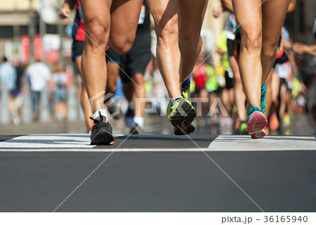 Marathon running in the light of evening Marathon running in the light of evening 36165940
