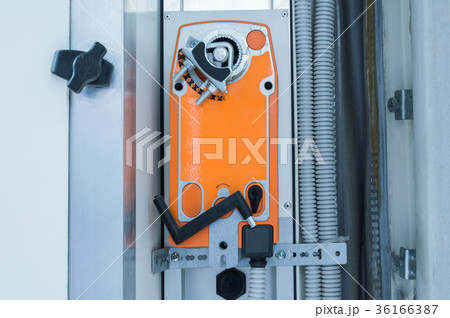 Orange industrial actuating motor nstalled on the Orange industrial actuating motor nstalled on the 36166387