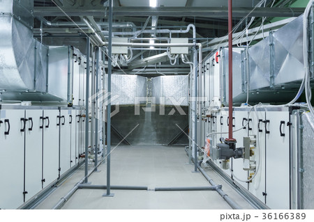 Two gray industrial air handling units in the 36166389