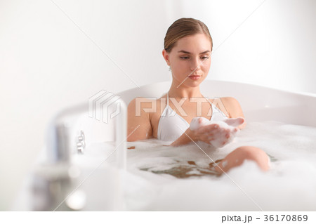 Sensual girl keeping water bubbles in arms Sensual girl keeping water bubbles in arms 36170869