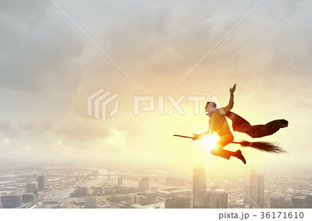 Businessman on broom Businessman on broom 36171610
