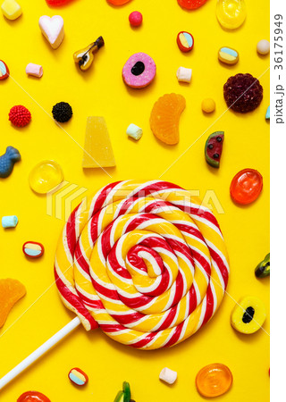 colorful candy on the yellow background colorful candy on the yellow background 36175949