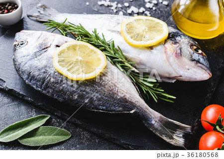 Fresh sea fish on slate board ready for cooking 36180568