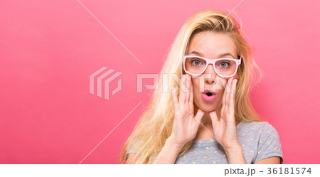 Young woman shouting on a solid background Young woman shouting on a solid background 36181574