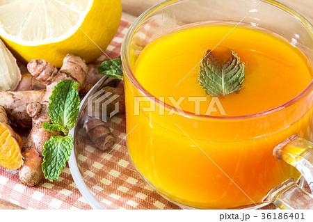 a cup of Turmeric Tea with lemon and ginger 36186401