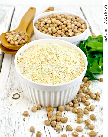 Flour chickpeas in white bowl with peas Flour chickpeas in white bowl with peas 36186798