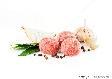 Composition with raw meatballs on the white 36189976