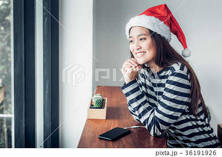 Asian teenage girl wear santa hat and smile face 36191926