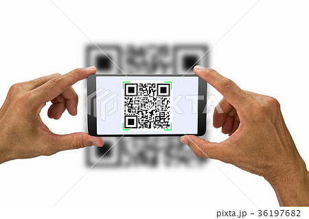 Hands holding smartphone scanning QR code Hands holding smartphone scanning QR code 36197682